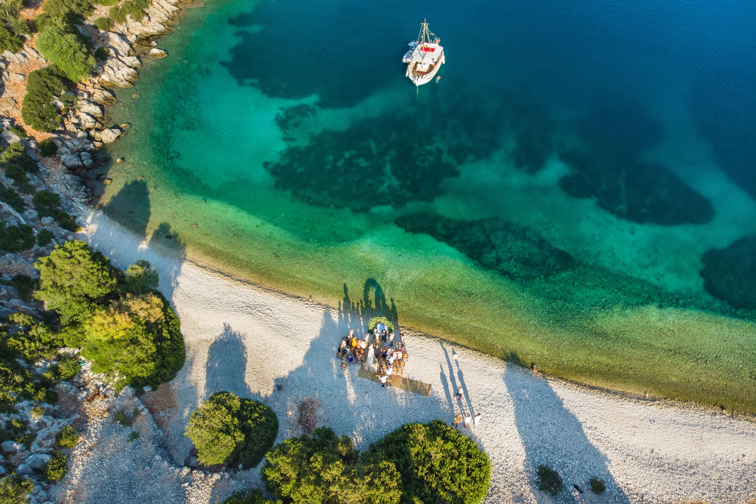 Greek destination wedding scene with coastal backdrop